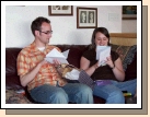 Phillip and Tess enjoying their cards from their grandparents -- ooh, is that a little green paper coming out of the bottom of Tess's card?