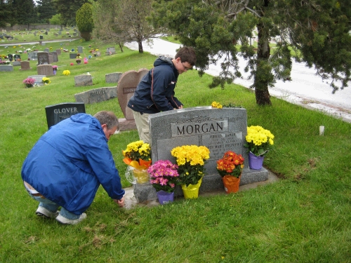 Alan and Clark performing the traditional grave site clean up.