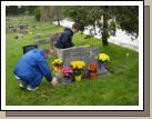 Alan and Clark performing the traditional grave site clean up.