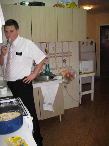 Elder Miller making cookies in our kitchen.