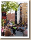 Cars with royalty / security  /and side-view of new museum on the right.