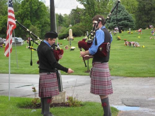 The Holladay Cemetary always has bagpipers which we think is totally cool -- Elliot thinks one day he might like to learn how to play the bagpipes.