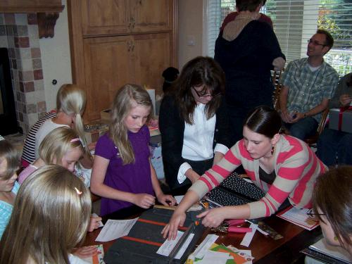 Everyone brought their favorite family recipes to scrapbook into a cute family cookbook for Loren and Anne to have.  The young girls especially loved using the paper cutter and gluing things.