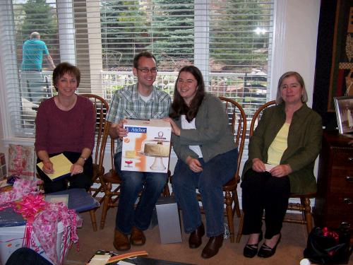 The happy couple opening their gifts with a proud mama on each side.  Anne's wonderful mother is Carol Bogue.