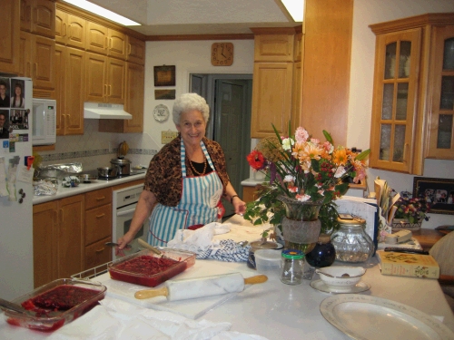 Grandma doing her Thanksgiving magic in the kitchen.