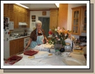 Grandma doing her Thanksgiving magic in the kitchen.