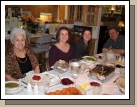 All ready for dinner -- Grandma, Tess, Madeleine and Alan.