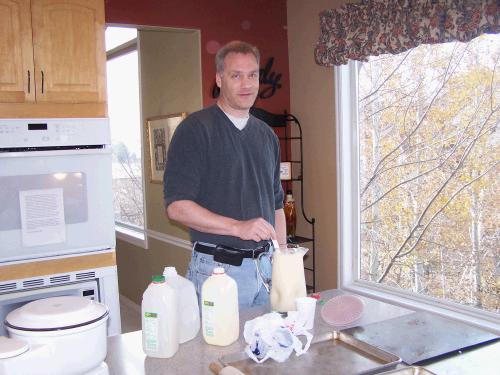 Mark mixing up the annual Thanksgiving perfect egg nog concoction.