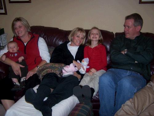 Melanie holding Daniel Crapo and Karen Crapo sitting between Megan and Brian.