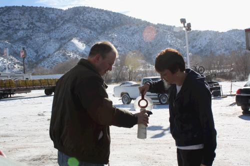 On the way to Arizona, it was so cold that by the time we got to Nephi, something to do with our windshield fluid froze, so when we stopped to get gas, I ran into the convience store to get a cup of hot water and the guy said to go ahead and take the whole pot!  Madeleine thought it was funny and took a picture. 