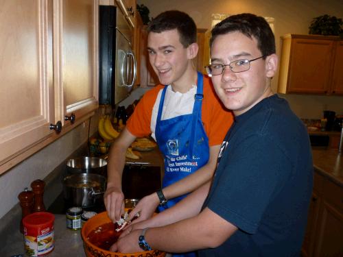 Elliot and Clark peeling a pomegranate for the fruit salad -- a true labor of love!