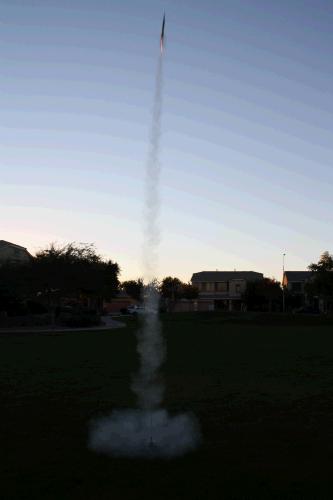 It probably went 200 feet into the air.  He launched it three times, but on the third time it drifted in the wind onto a neighbor's roof and so we were done for the day. Very fun -- the kids loved it!