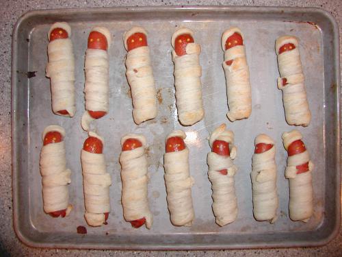 The hot dog mummies that Alan thought looked like two rows of hospital invalids.