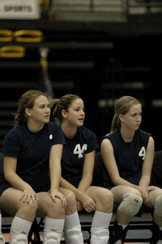 Tess, Jennie, and Hana cheer on the Varsity team.