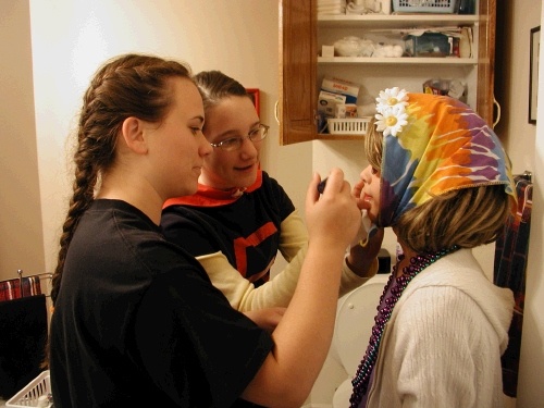 Tess and Madeleine putting the final touches on Elliot.