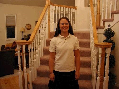 First day of school.  Yes, I made Tess smile for me before going off to early morning seminary.  It's actually a fake smile, because she isn't really that excited to be leaving that early!  
Tess is a junior this year.