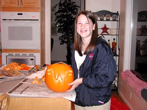 Madeleine with her Weezer rock group pumpkin.