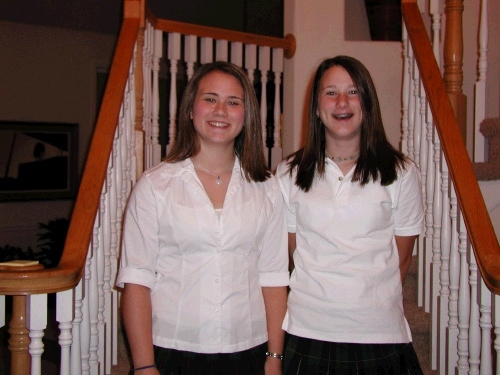 Tess and Madeleine pretending enthusiasm for their first day of Seminary and school.