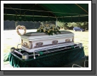 Grandma's beautiful casket with just a couple of flower arrangements.  She wanted things very simple.