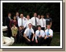 An Arjona family gathering for the birthday and ordination of their son Danny who turned 12 (second in from the right on back row). The matching ties are coincidental. Hermano Arjona is taking the picture and his wife is peeking out from the back. Their four sons are Samuel (oldest, far right), Reuben (in between us), Danny, and David (the clown in the striped shirt).