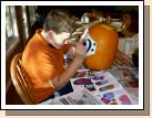 Transferring the pattern onto the pumpkin.