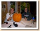 Some of Elliiot's school friends came over to carve, have dinner and go trick-or-treating together.  This is Natalie outlining her carving while Kylee looks on.